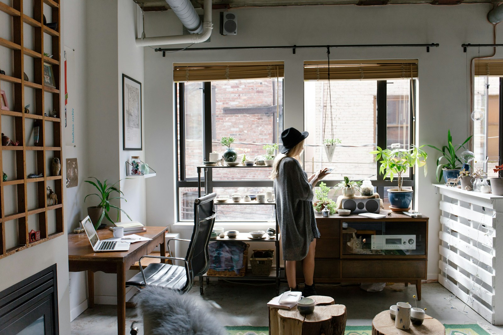 woman with renters insurance standing near brown wooden cabinet